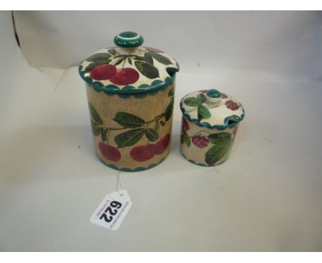 A WEMYSS PRESERVE POT, painted with cherries, (crazed) and a Wemyss mustard pot painted with blackberries (2)