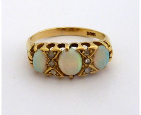 AN OPAL AND DIAMOND RING, the three oval shape opals with rose cut diamond accents to the plain tapered band, stamped 18ct, r