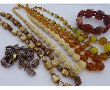 A SELECTION OF VINTAGE NECKLACES and a bracelet to include a 1930`s ivory and bone carved necklace a banded agate necklace to