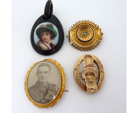 FOUR ITEMS OF JEWELLERY, to include a piece of jet with a portrait, a memorial picture brooch together with two further brooc