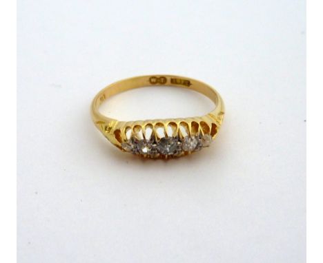 A VICTORIAN 18CT GOLD DIAMOND RING, comprising of five old cut diamonds to the tapered shank, diamond weight stamped to band 