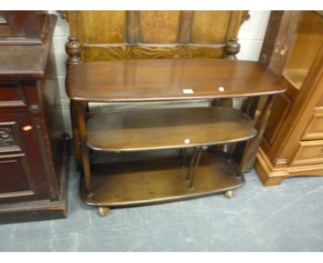 AN ERCOL SET OF THREE TIER SHELVES, on casters