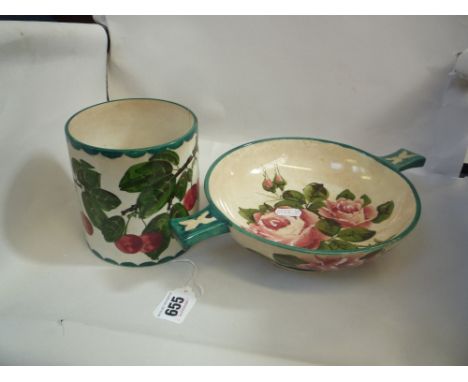 A WEMYSS POT, painted with cherries, retailed by T. Goode & Co, height 12cm and a Wemyss quaich painted with roses and green 