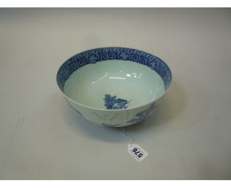 A CHINESE BLUE AND WHITE BOWL, Qianlong, of plain rounded form raised on a ring foot, painted riverscape with trees and build