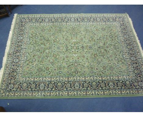 A GREEN GROUND FLORAL PATTERNED CARPET, approximate size 340cm x 250cm