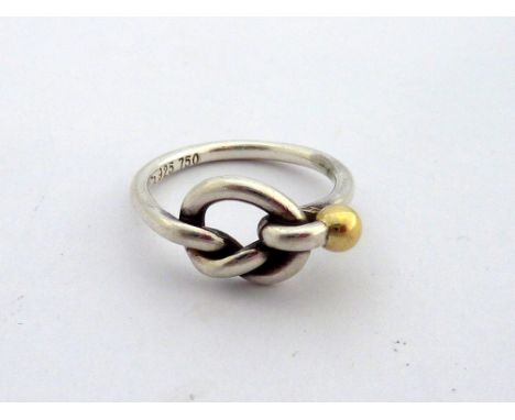 TIFFANY AND CO, a friendship knot ring, signed Tiffany and Co. 925 750, ring size