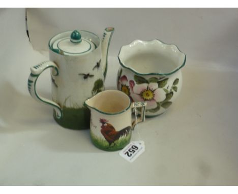 THREE PIECES OF WEMYSS POTTERY, including coffee pot, decorated with Bees and Hive (s.d.), a cream jug 'Bon Jour' decorated w