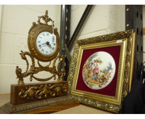 A REPRODUCTION EMPIRE STYLE MANTEL CLOCK, and pottery framed plaque (2)