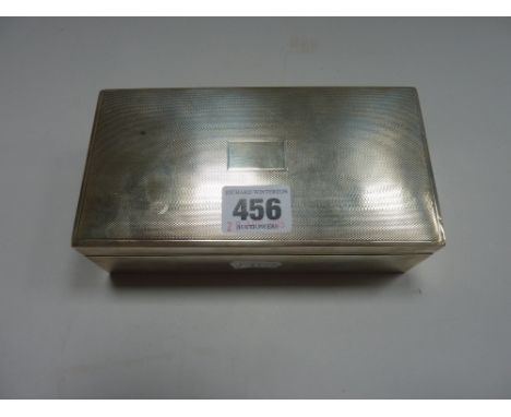 A SILVER CIGARETTE BOX, Birmingham 1947, of rectangular form with engine turned decoration, 16.5cm x 9cm x 5.5cm