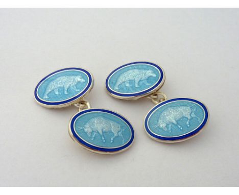 A PAIR OF SILVER ENAMEL CUFFLINKS, depicting a stalking bear and a charging bull, hallmarks for Birmingham