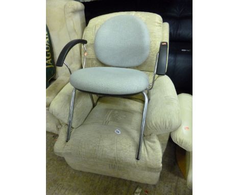 AN UPHOLSTERED MANUAL RECLINING ARMCHAIR