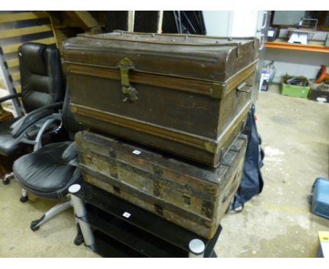 A VINTAGE METAL FRAMED TRAVELLING TRUNK, and a tin trunk