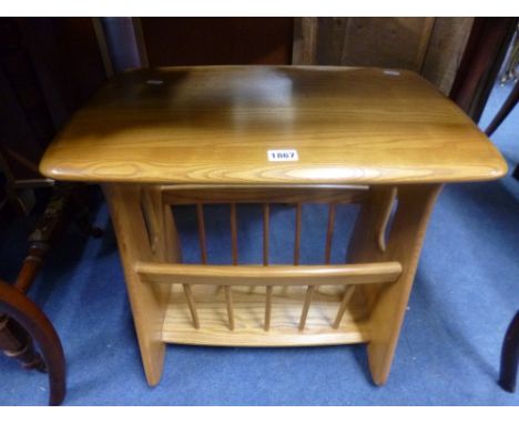 A BLONDE ERCOL MAGAZINE RACK/TABLE