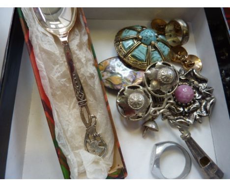 A SMALL BOX OF MISCELLANEOUS, to include a spoon, rattle, brooches, rings and cufflinks