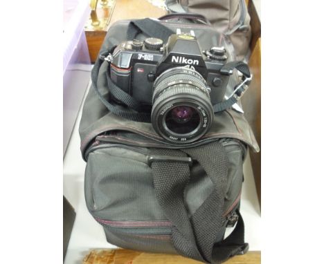 A NIKON F-301 CAMERA, and accessories in carry case
