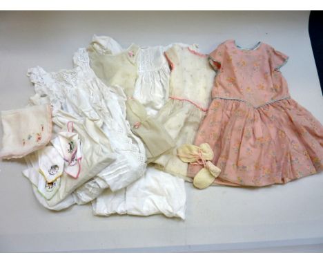 A COLLECTION OF VINTAGE CLOTHING, to include two christening gowns, a set of seven handkerchiefs, two bridesmaids dresses, a 
