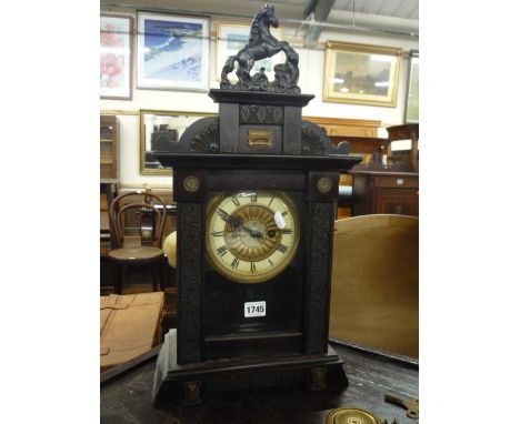 A 19TH CENTURY STAINED PINE MANTEL CLOCK, (key and pendulum)