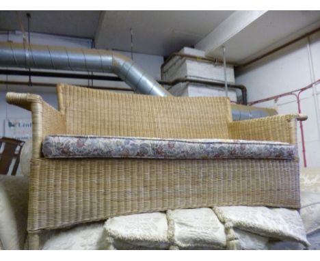 A WICKER TWO SEATER SOFA