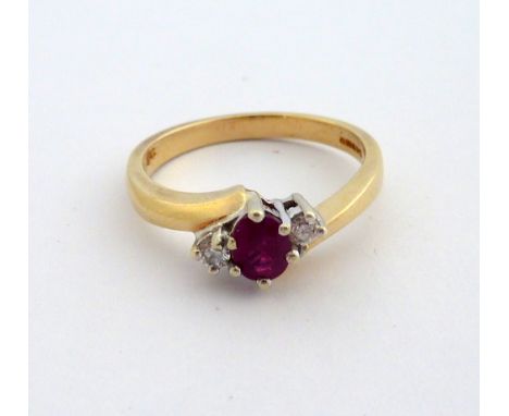 A 9CT GOLD RUBY AND DIAMOND RING, the oval shape ruby flanked by brilliant cut diamonds on a twisted plain shank, hallmarks f