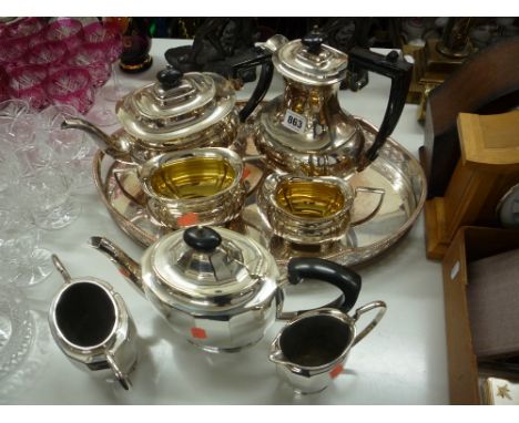 A FOUR PIECE EPNS TEA SERVICE, another three piece service and a galleried edge tray (8)