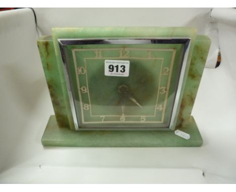 AN ELECTRIC ONYX MANTEL CLOCK