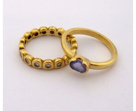 TWO RINGS, the first an 18ct gold tanzanite ring together with a full diamond eternity ring, hallmarks for Birmingham