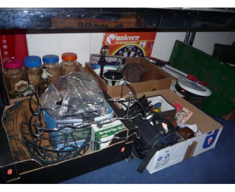 FOUR BOXES AND LOOSE SUNDRY ITEMS, cameras, dart board, racquets, bagatelle, glass jars etc