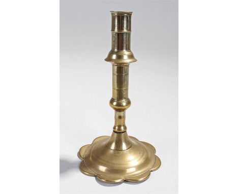 18th Century brass ejector candlestick with petal foot. 