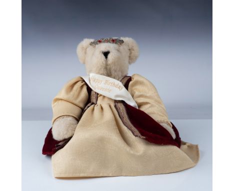 Charming Vermont Teddy Bear from the Vermont Teddy Bear Company, dressed in a royal-themed outfit. The bear wears a velvet re