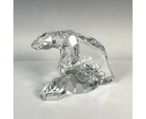 Stunning clear crystal depiction of a lone polar bear climbing an iceberg. Swarovski backstamp. This item has its original bo