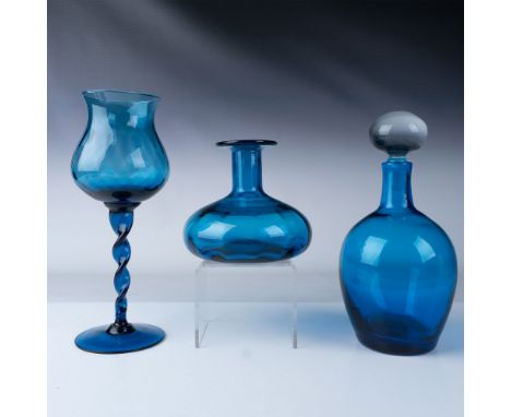 This is a vibrant collection of three hand-blown blue glass pieces, showcasing exceptional craftsmanship and elegant design. 