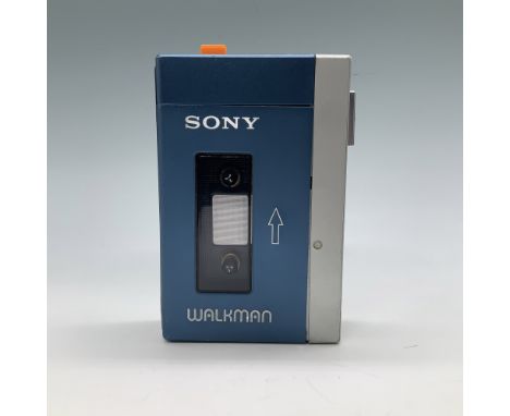 This vintage Sony Walkman TPS-L2 portable cassette player, introduced in 1979, is a hallmark of personal audio history. The d