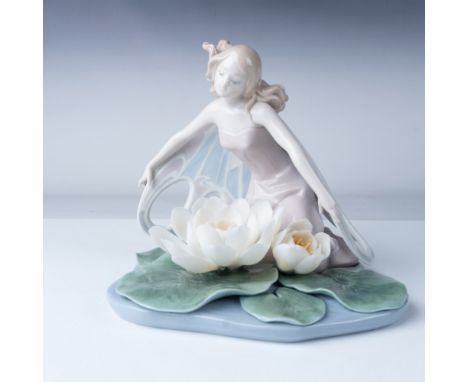 This Lladro Wings of Fantasy porcelain figurine, model number 06651, features a delicately crafted fairy kneeling beside two 