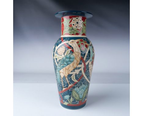 This beautifully hand-painted vase is by the renowned Butlerswood, featuring vibrant colors and intricate designs of birds an