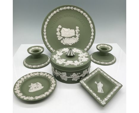 A charming collection of Wedgwood sage green jasperware, featuring white bas-relief detailing. The set includes a William Sha