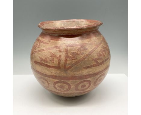 Earthenware pot from the Narino culture circa 800-1500 CE, designed with red pigment over brown slip Manganese with light ear