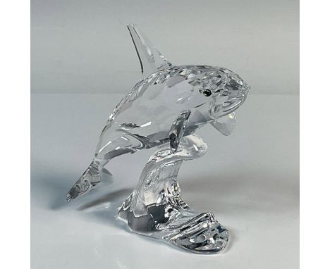This killer whale was part of the South Sea collection. It is made from clear crystal with a jet eye, and is depicted riding 