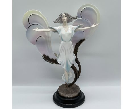 Modeled by Gregory Rose, this limited edition number 16 figure floats above a metal base with pointed toes and open arms, her
