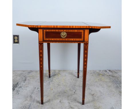 An elegant Edwardian-style mahogany drop-leaf side table by Council Craftsmen, renowned for their exceptional woodworking and