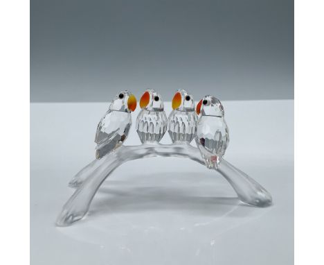 The four faceted clear crystal Lovebirds have Fire Opal beaks, and Jet black eyes. They are perched on a frosted three-pronge