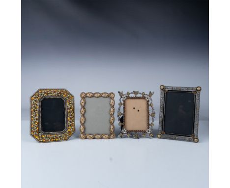This set of four vintage picture frames features intricate rhinestone embellishments in a variety of colors, including amber,