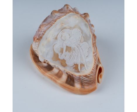 Semi translucent polished shell with scene depicting a floating Angel carrying an inscribed tablet. Issued: 20th centuryDimen