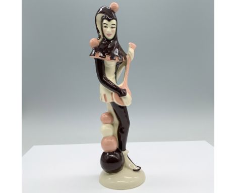 Hand painted porcelain features a large figurine on brown, pink and white colors with a luster and round base. Ceramic Arts S