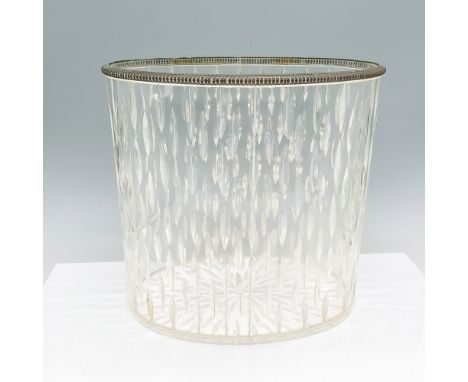 A vintage Lucite wastebasket featuring a textured diamond pattern that adds a decorative touch. The translucent body is accen