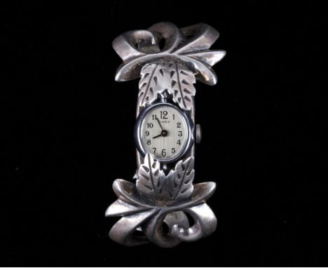 For consideration is this Navajo sand cast sterling silver watchband from Navajo artist Frances Jones. The watchband shows ic