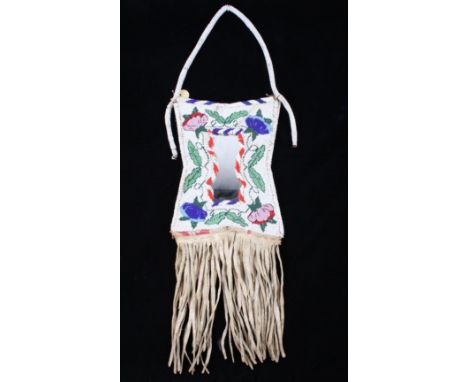 The lot features a fully beaded flat mirror bag from the Crow Native American Indians of the 10th Century. The piece shows an