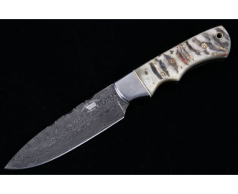 This is an original Montana Territory Knives of Bozeman, Montana knife showing a Rocky Mountain Rams Horn grip and forged Dam