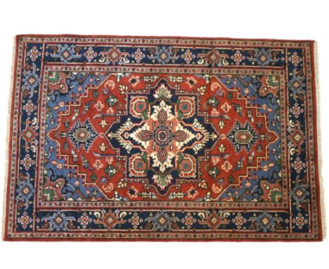 Included in this lot we have a Persian Heriz Serapi hand knotted wool runner rug. The rug features a fine detailed design, br