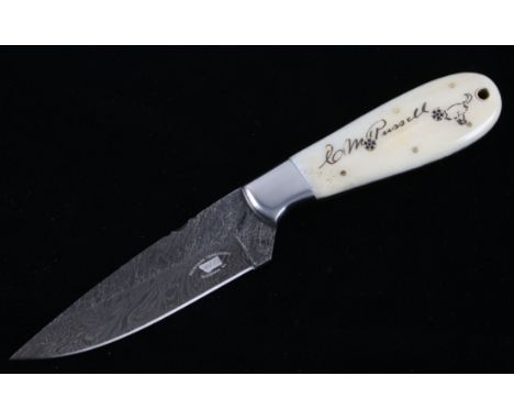 This is an original Montana Territory Knives of Bozeman, Montana camp knife with an excellent scrimshaw Charles M. Russell si