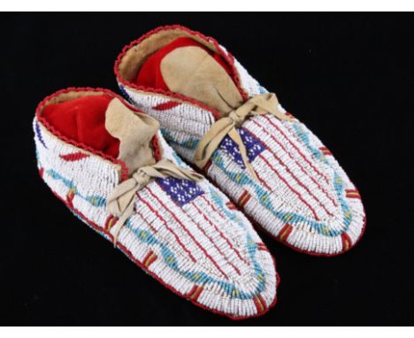 The lot features a fantastic set of fully top and bottom beaded ceremonial moccasins from the Northern Cheyenne Native Americ